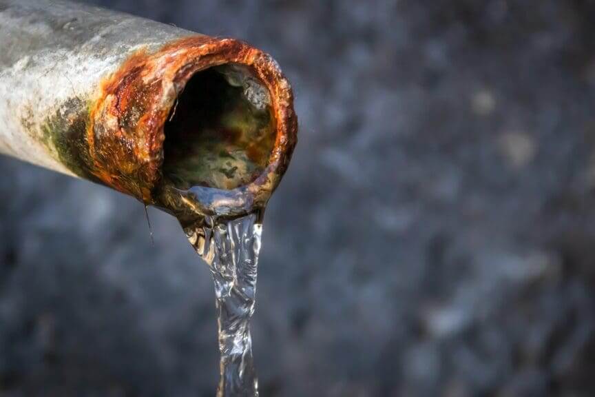 Lead pipes photo of a rusty water pipe