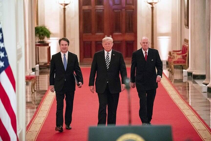 Trump walking with brett kavanaugh and a retired justice