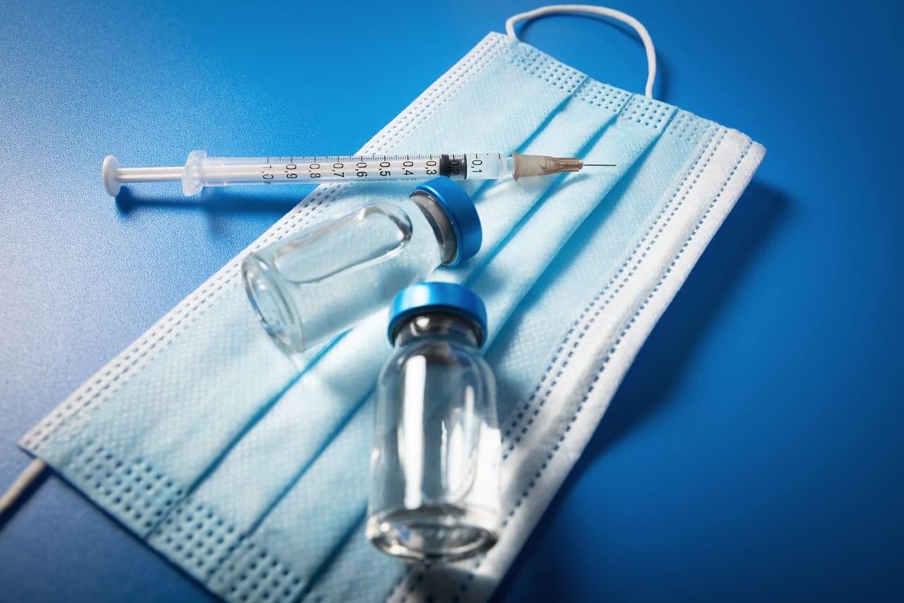 Vaccine vial, syringe, and mask