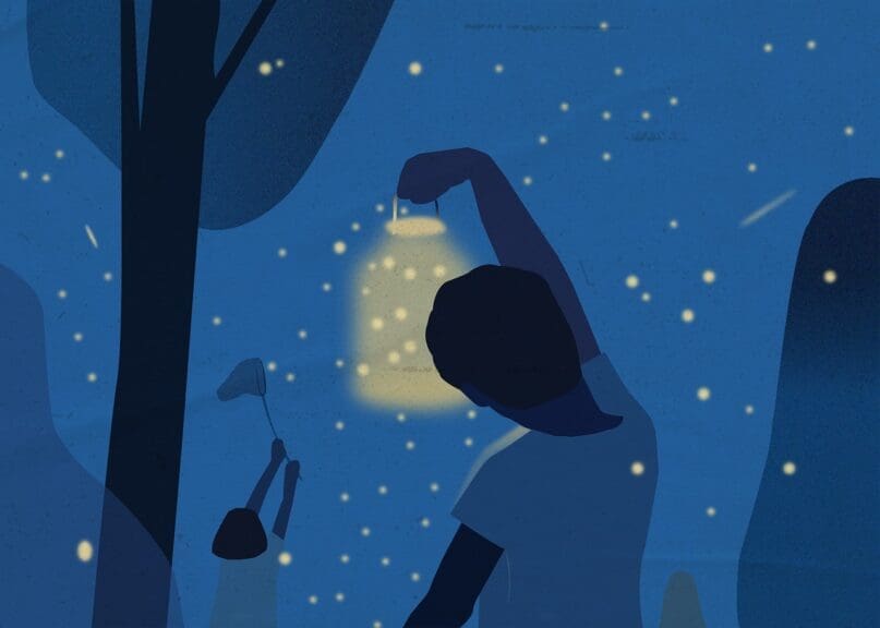 Kids out at night catching fireflies