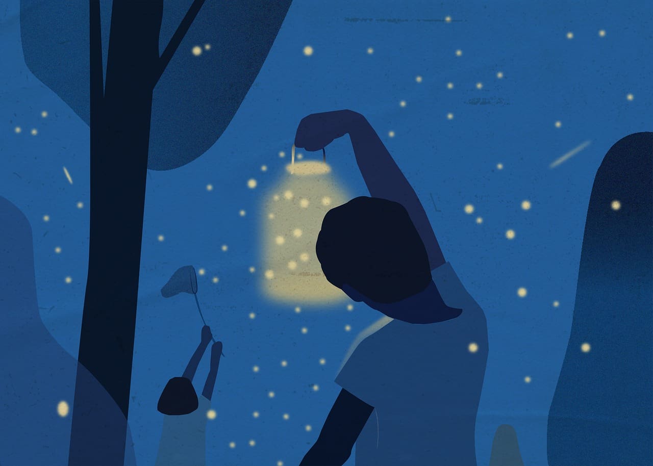 Kids out at night catching fireflies
