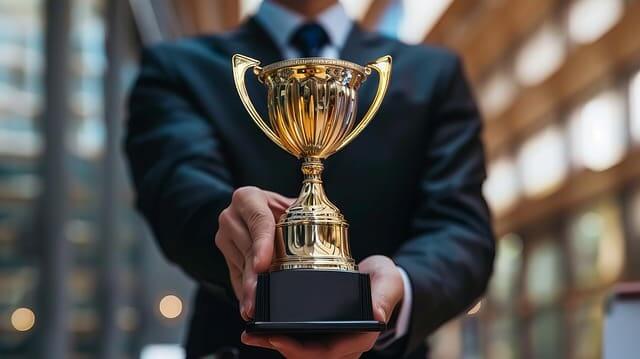 Trophy being handed to the reader signifying an award for best climate change denialists