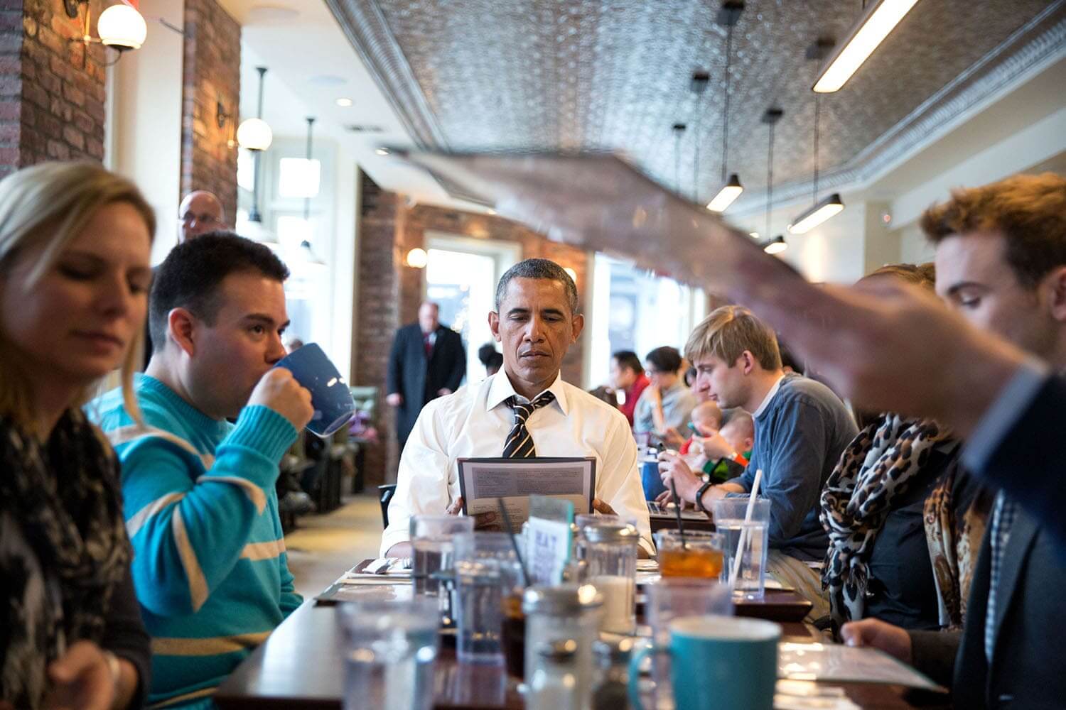 Barack obama at a restaurant for a meeting on obamacare