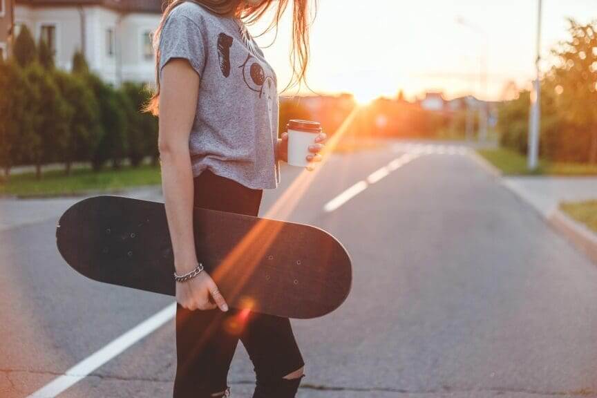 Skater gudl crossing the street