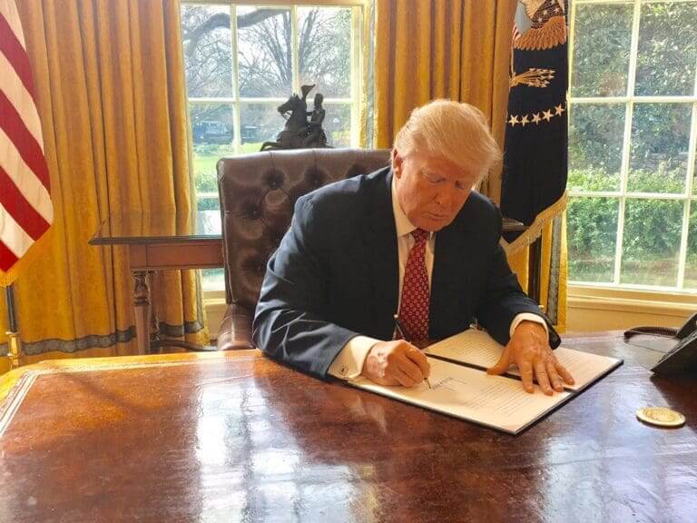 Trump signing an executive order on bureau of prisons