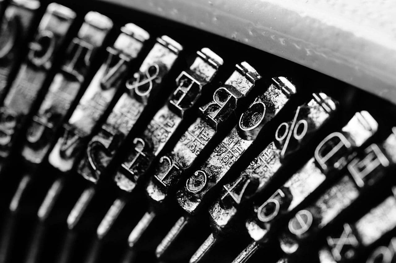 George orwell was opposed to totalitarianism. Metal letters inside a typewriter close up and in black and white