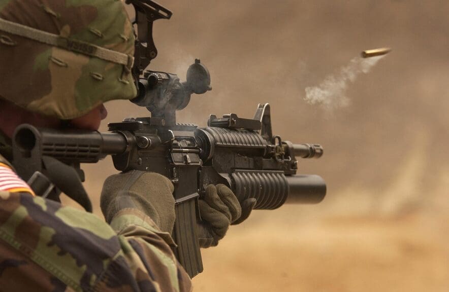 Resolution on banning arms to israel. Soldier firing a gun