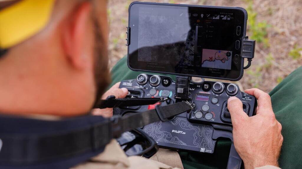 Wildfire drone operator holding a controller