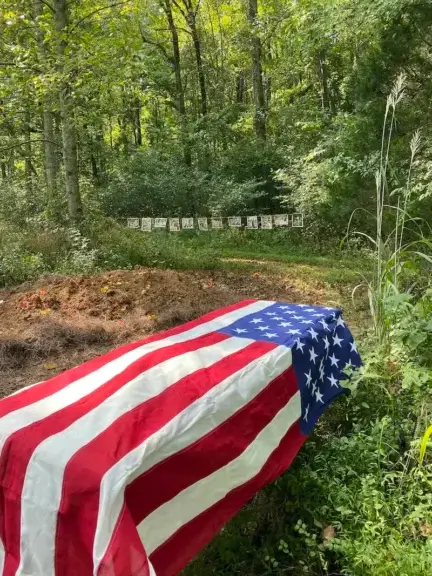 green burials3 Example of a green burials casket with an american flag over it.