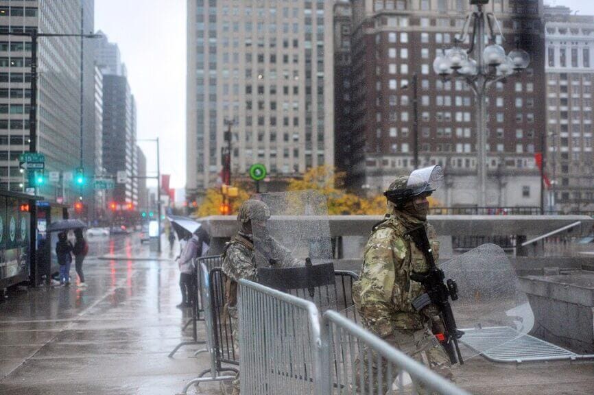 Trump supporters wearing camo and holding rifles at an event in philly 3 days before the 2020 election.