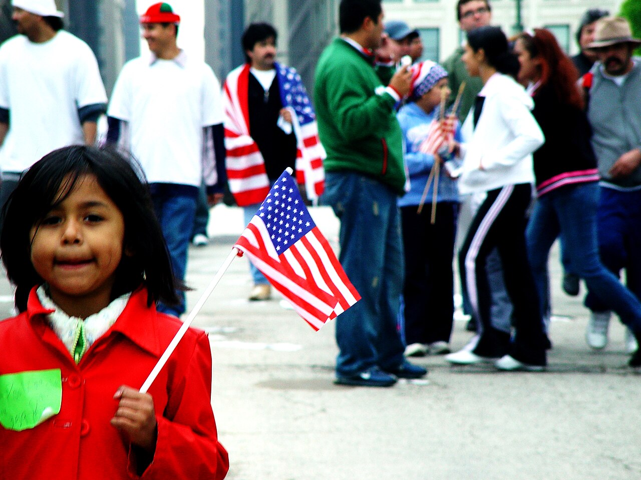 Cbp agents are back in chicago. A little girl holding an american flag at a 2006 immugration protest in chicago