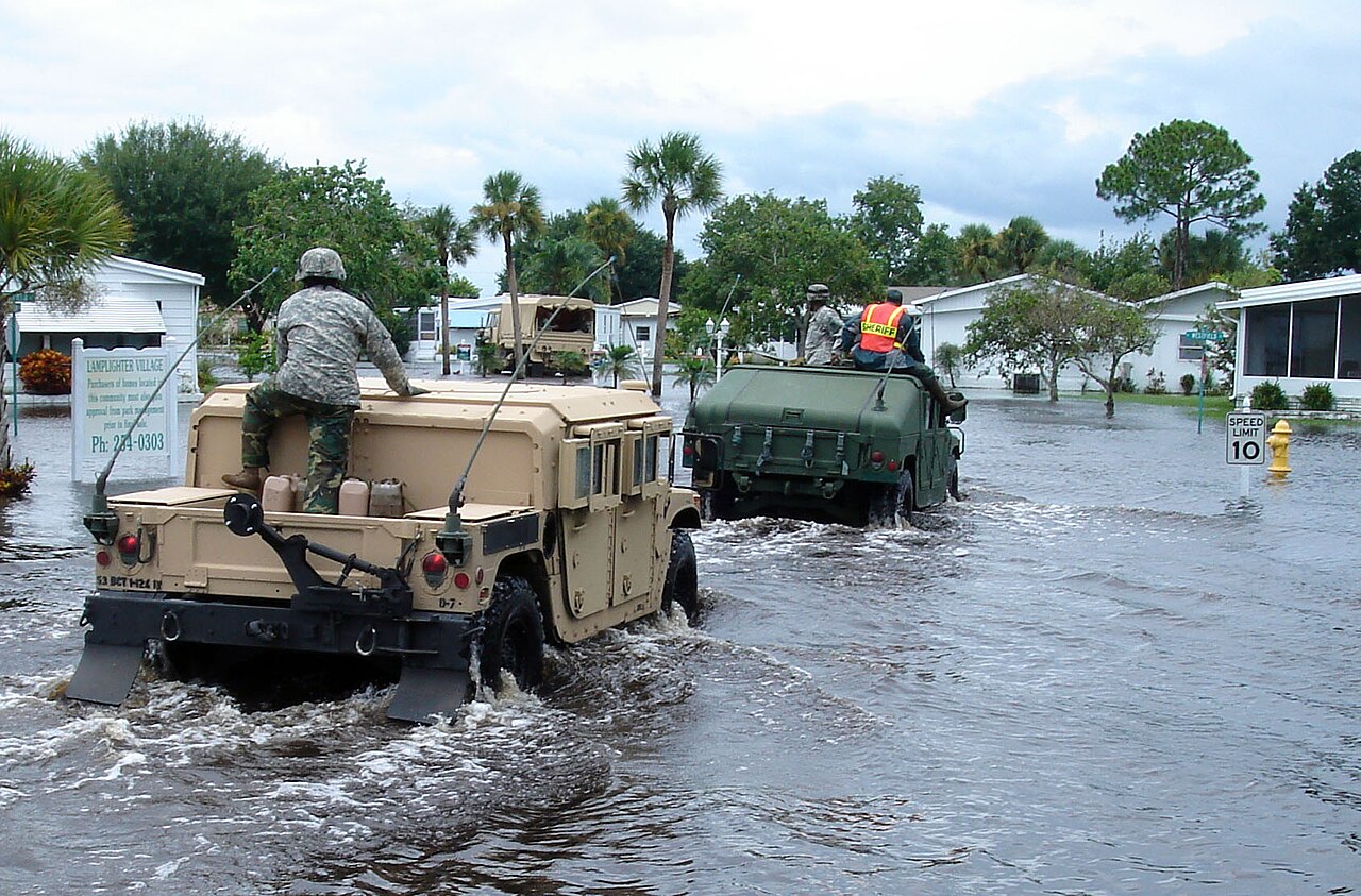 National guardsmen rescuing florida residents after flooding from hurricane fay in 2008.