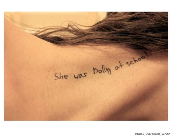 New epstein photos writing on the back of a woman’s neck
