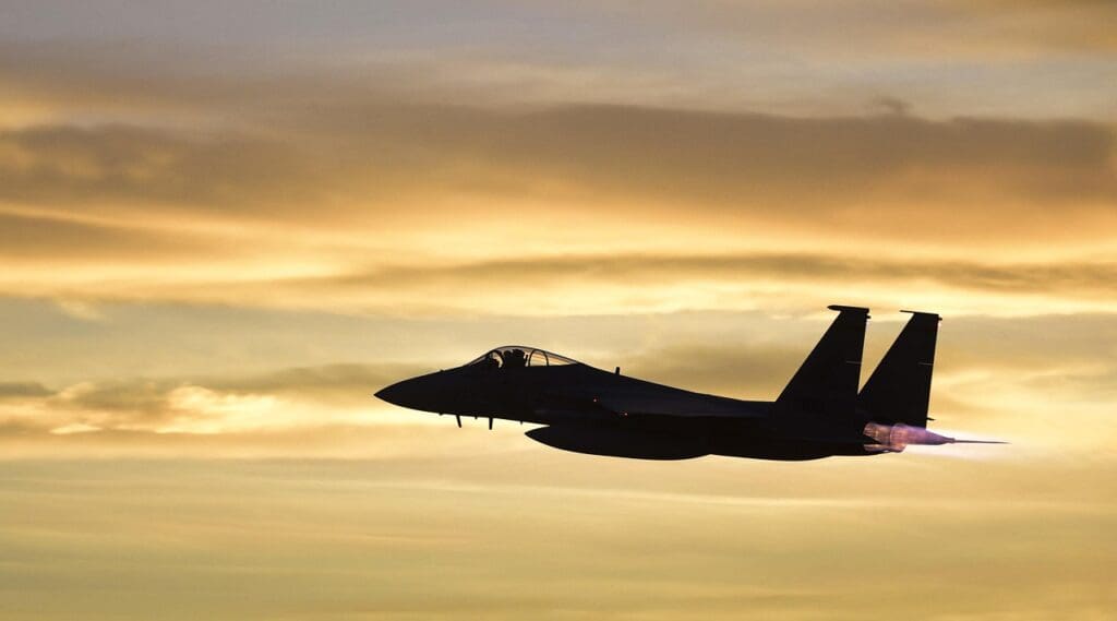 Us strikes in nigeria. A military plane flying as the sun sets