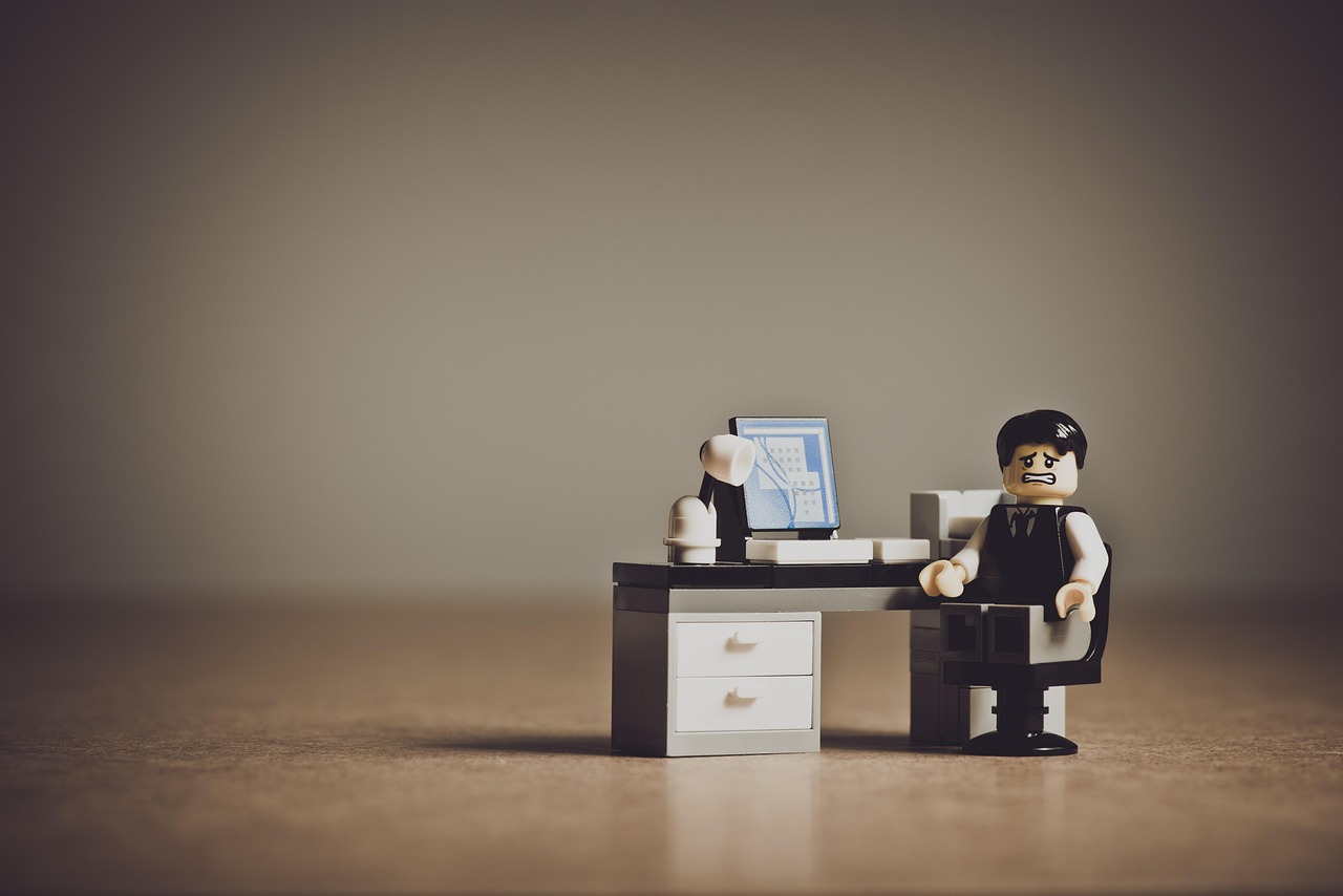Ai won't replace you at work. Lego office worker.