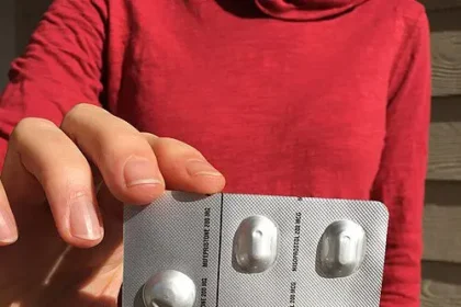 Hand holding abortion pills women's rights