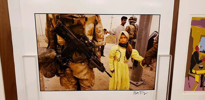 iraq war girl in yellow Israeli propaganda pushed us into the war with iran. Similar to the war in iraq. A little girl wearing a yellow dress is led by an american soldier in iraq