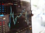 Stock market ticker on a slanted computer monitor