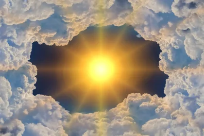 Sun shining through clouds and greenhouse gases