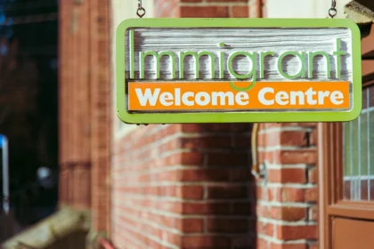 Immigrants welcome center sign Temporary Protection Status