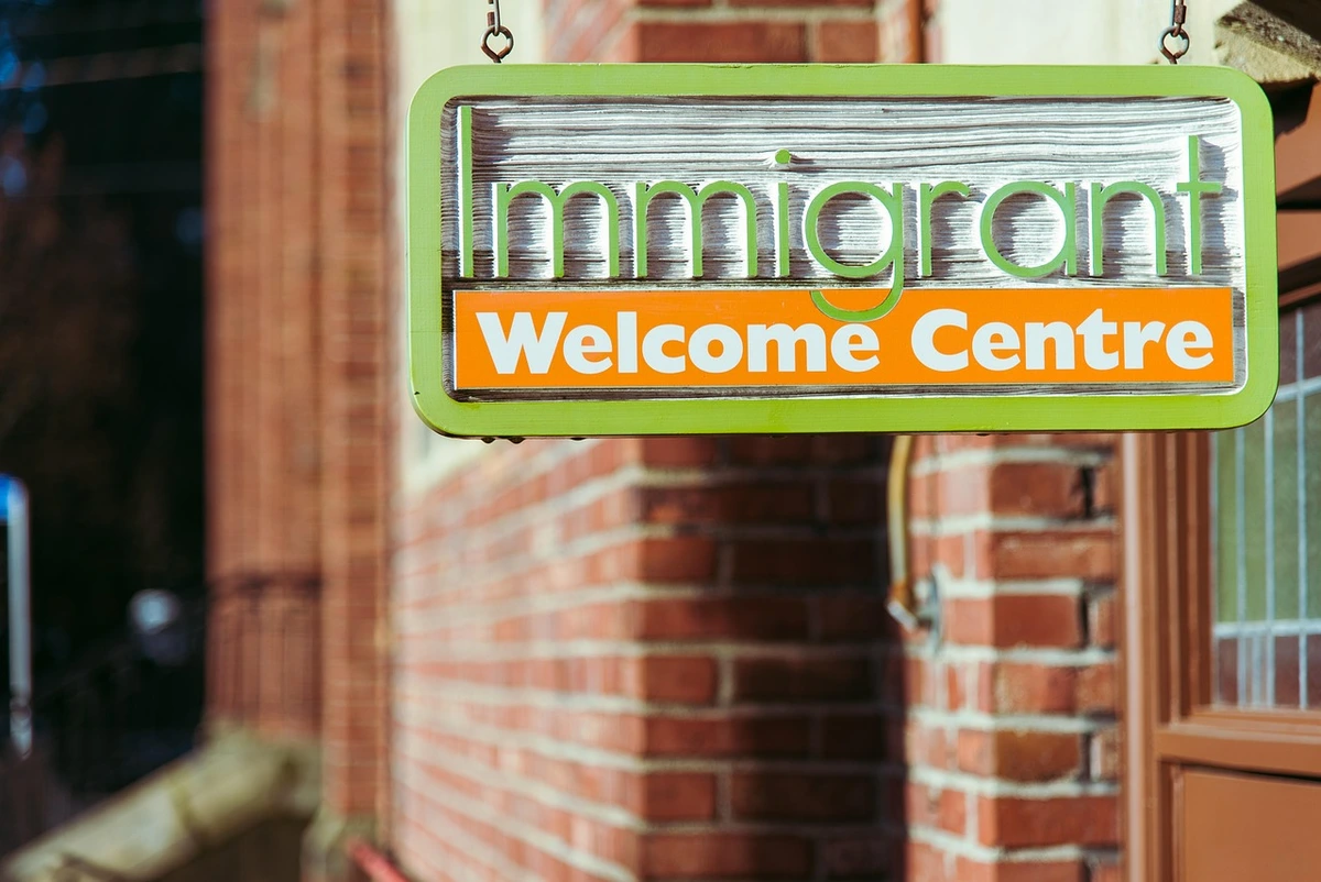 Immigrants welcome center sign temporary protection status