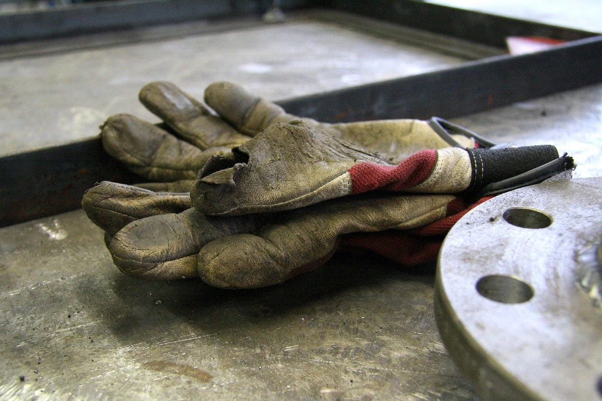 Immigrant workers pay taxes. Constructionworker’s gloves