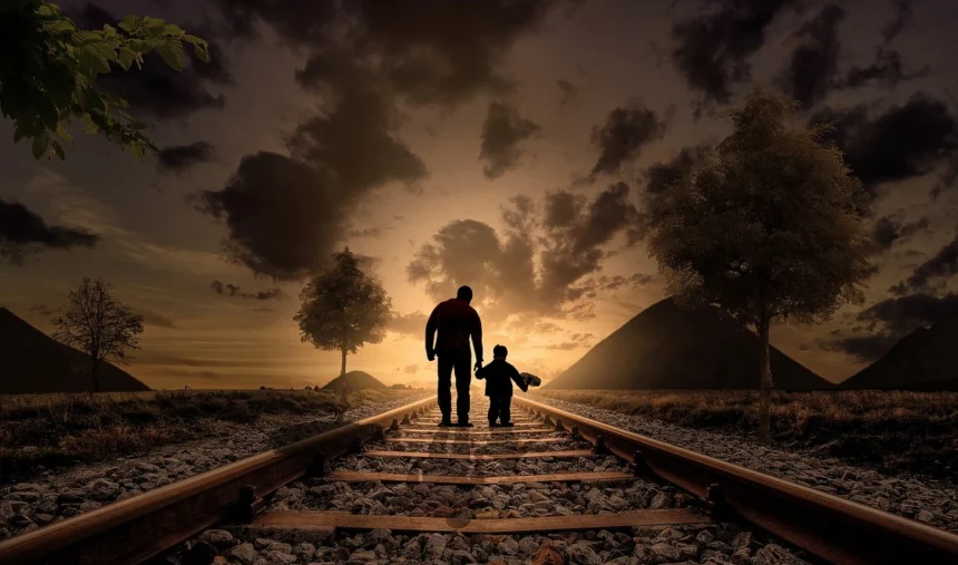 Israeli soldiers tortured an 18-month-old. Father and son walking in railroad tracks at sunset