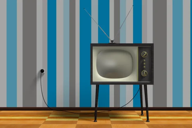 Retro television in a room with striped wallpaper and wooden floor. Broadcast licenses