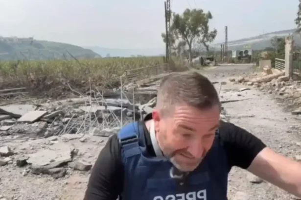 Steve sweeney ducks and covers right before an israeli bomb hit, injuring him.