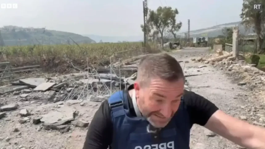 Steve sweeney ducks and covers right before an israeli bomb hit, injuring him.