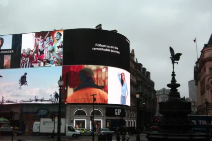 Digital advertising billboards tower over London's Picadilly Circus.