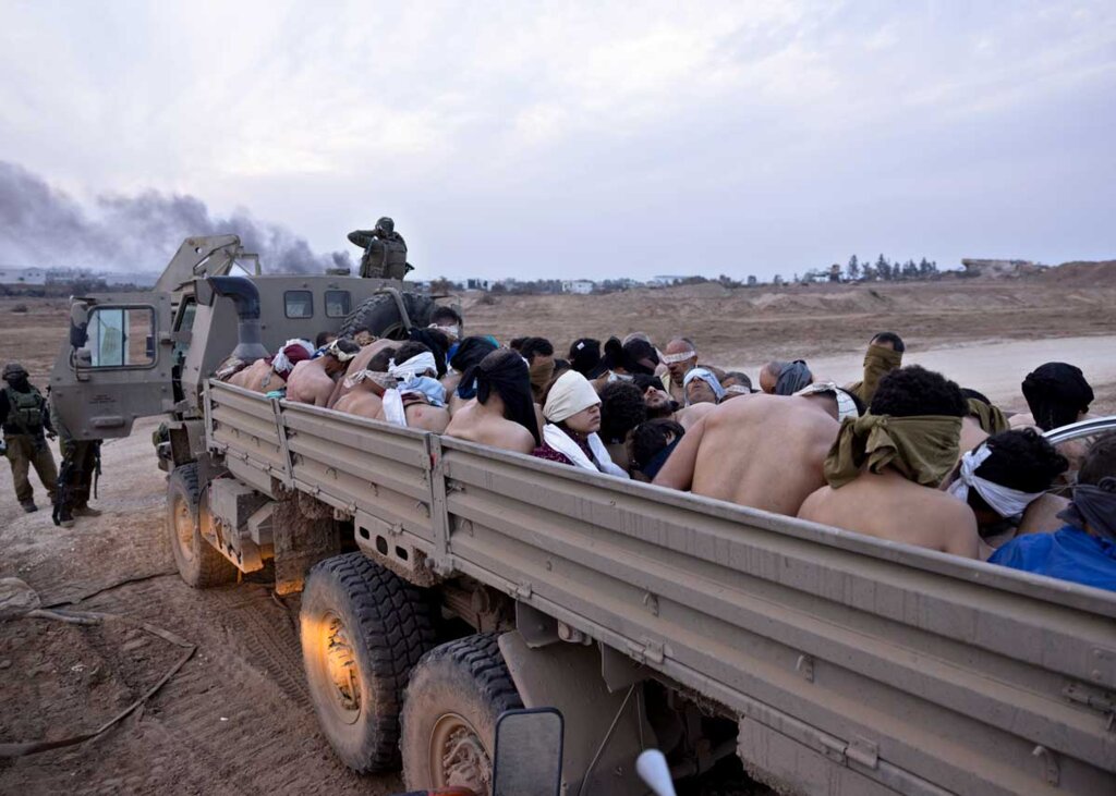Truck full of Palestinian prisoners, some who were victims of the torture in Israeli prisons