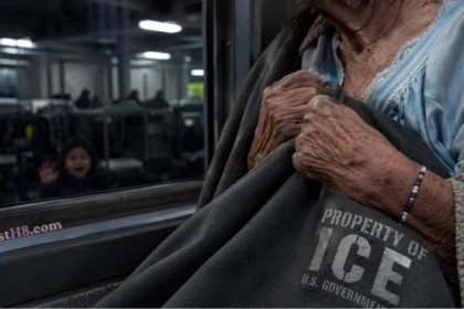 An 85-year-old widow of a member of the military clutches a blanket inside an ice detention facility, where she spent 16 days.