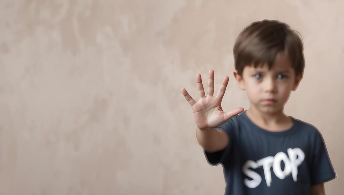 great little boy stop Little boy wearing a t-shirt that says stop, hold up a hand to say stop harassing people for having humanity