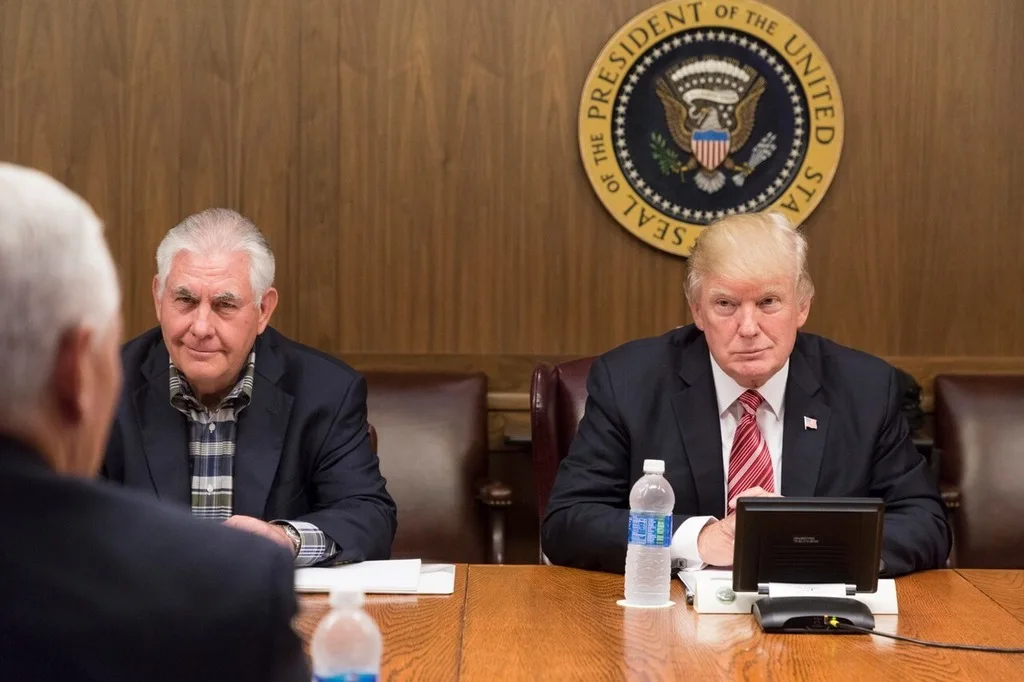Rex tillerson sitting next to the president at a cabinet meeting meeting during trump’s first term.